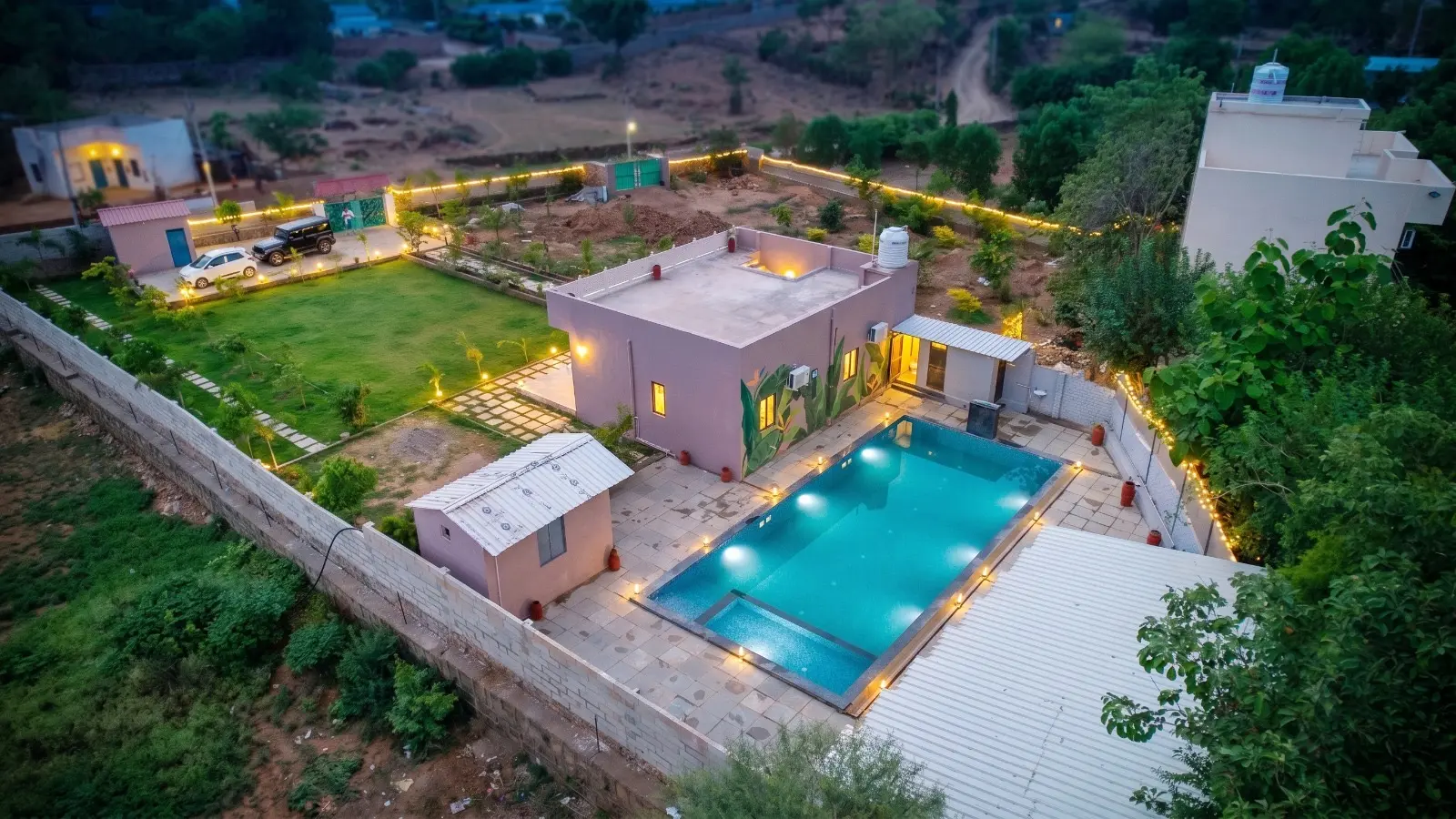 Private swimming pool and villa at evening